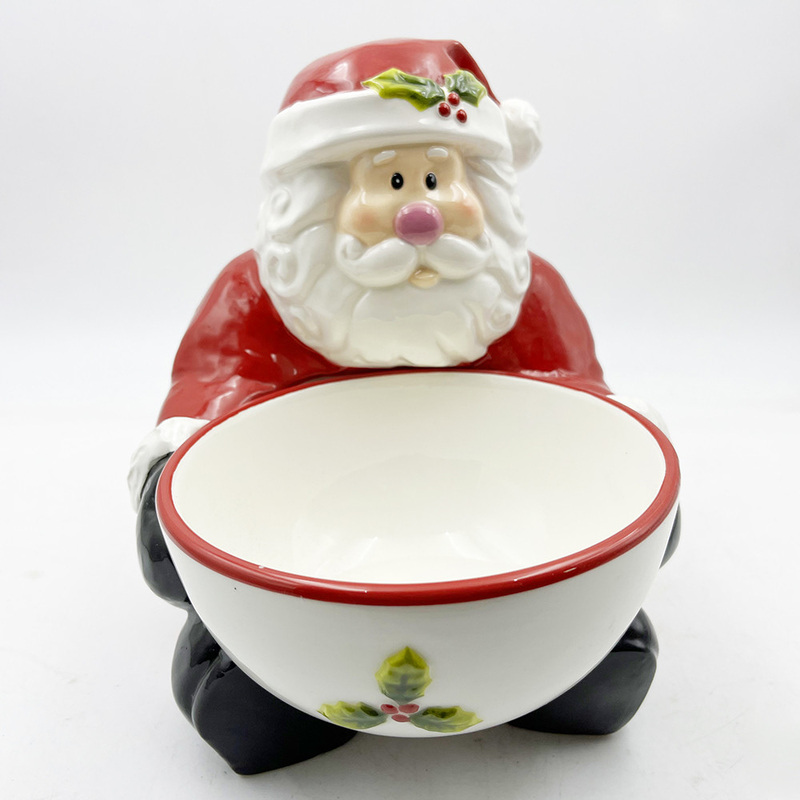 Cucine di ceramica con ciotole di caramelle dipinte a mano con la maniglia di Babbo Natale